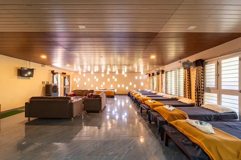 Dormitory with a long row of beds