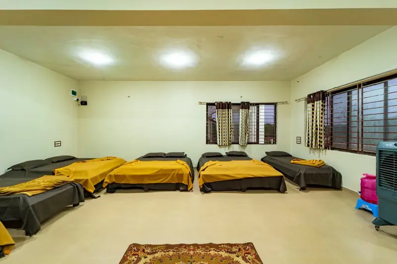 Dormitory with beds in a bright hall