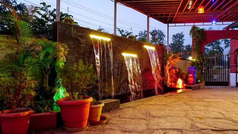 The garden water wall at night