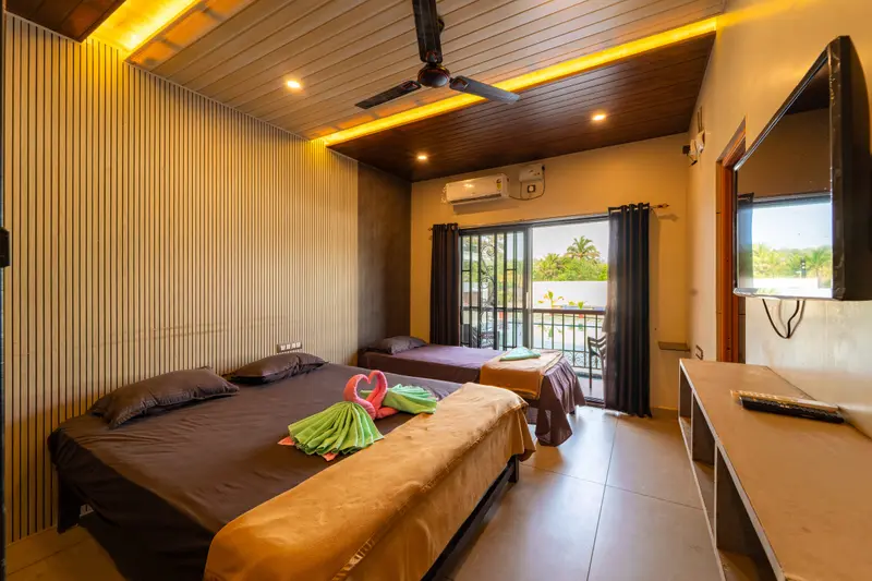 Family room with a double bed and television