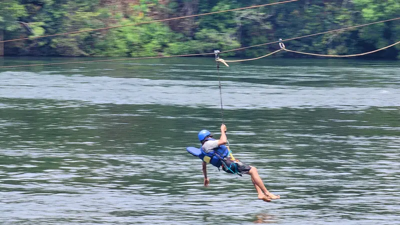A zipline crossing over the river